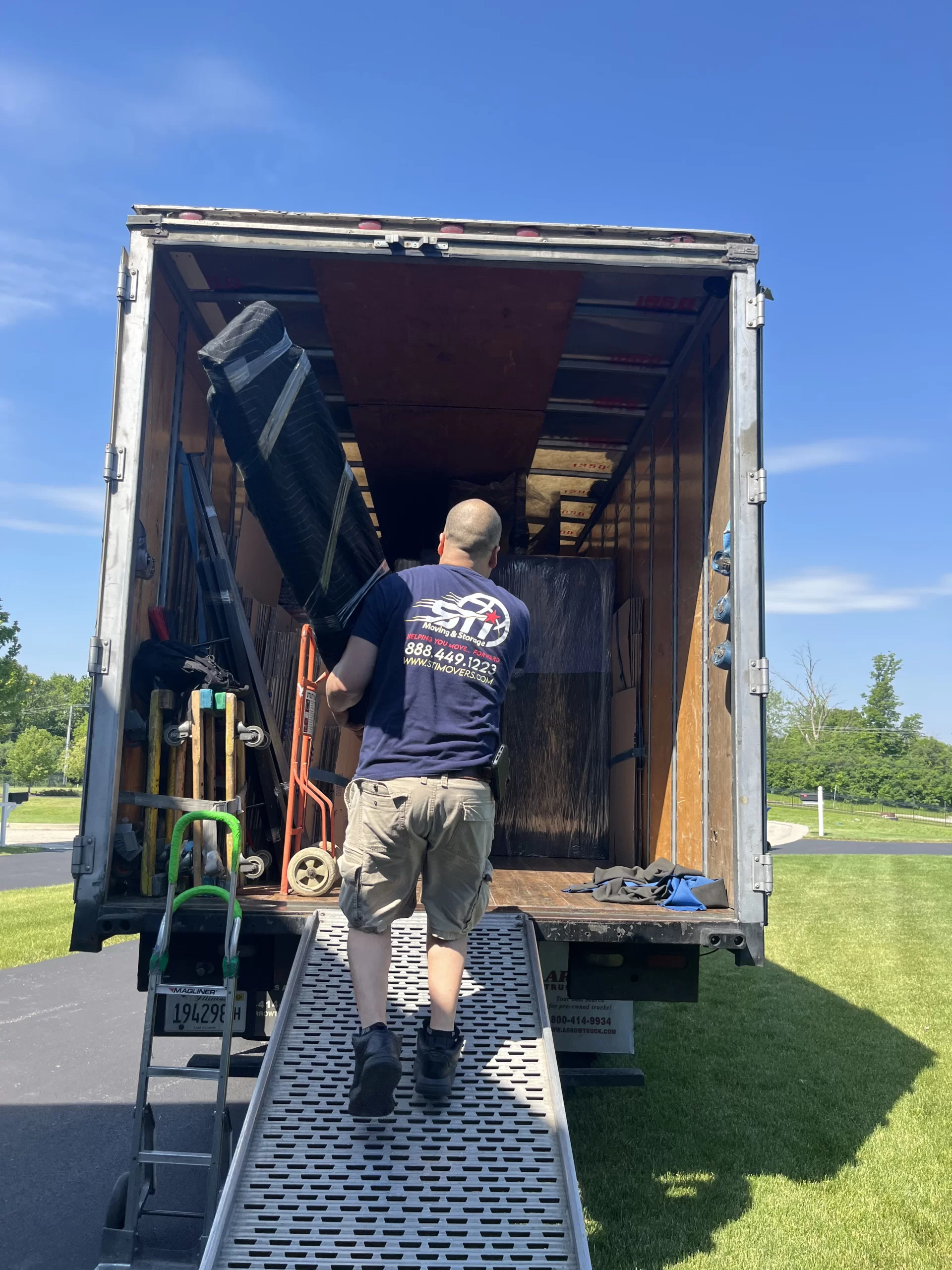 Great Lakes IL movers loading furniture in North Chicago apartment