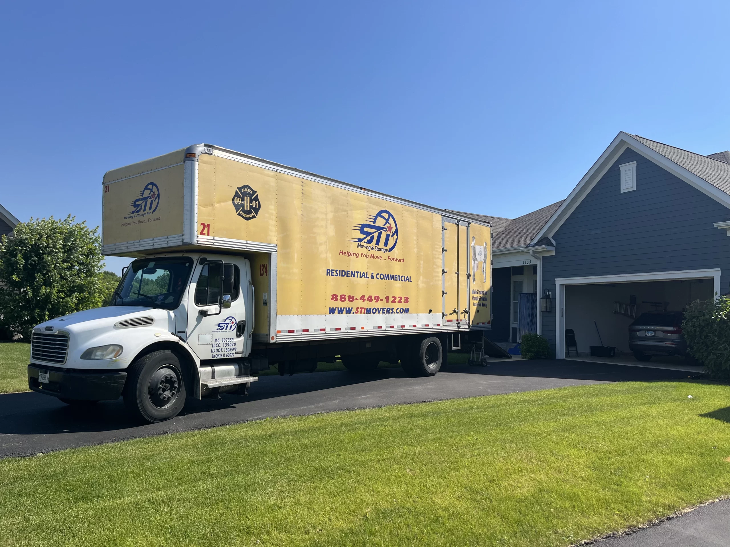 Ingleside movers packing truck near Long Lake