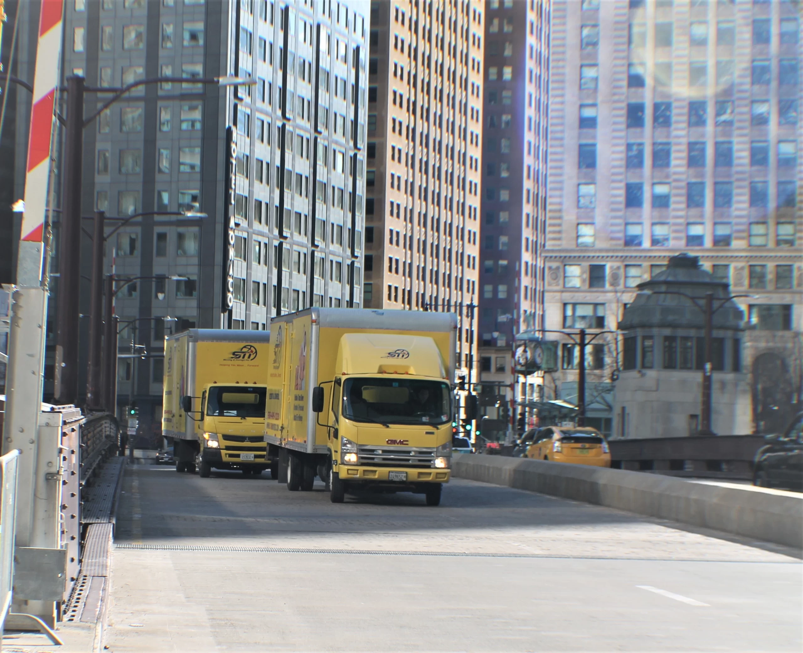 Movers in West Loop Chicago loading boxes into a condo building